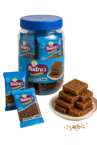 rudras sesame chikki jar , packet and sesame chikki in ceramic plate